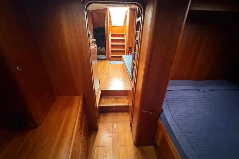 Lino Yacht Photos Pics Interior of 2019 Chatam Extreme 42 yacht with wooden finish and cozy sleeping area.