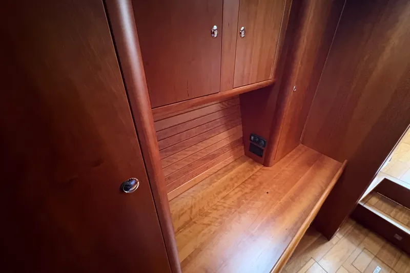 Lino Yacht Photos Pics 2019 Chatam Extreme 42 interior with wooden cabinetry and seating area.