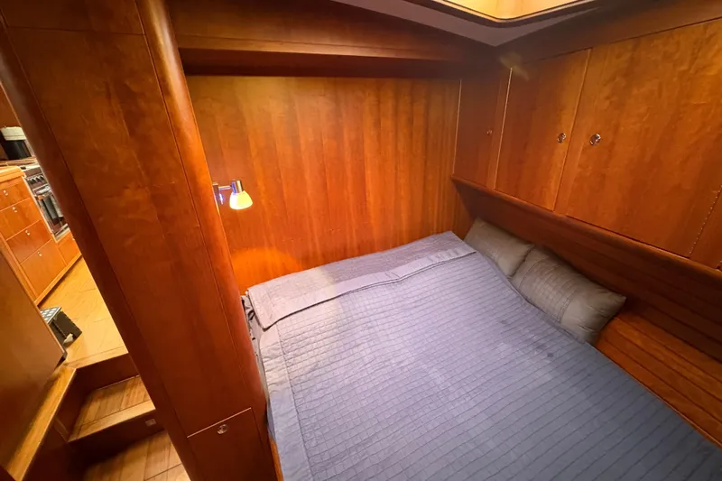 Lino Yacht Photos Pics Luxurious wooden cabin interior of 2019 Chatam Extreme 42 yacht with cozy bed.
