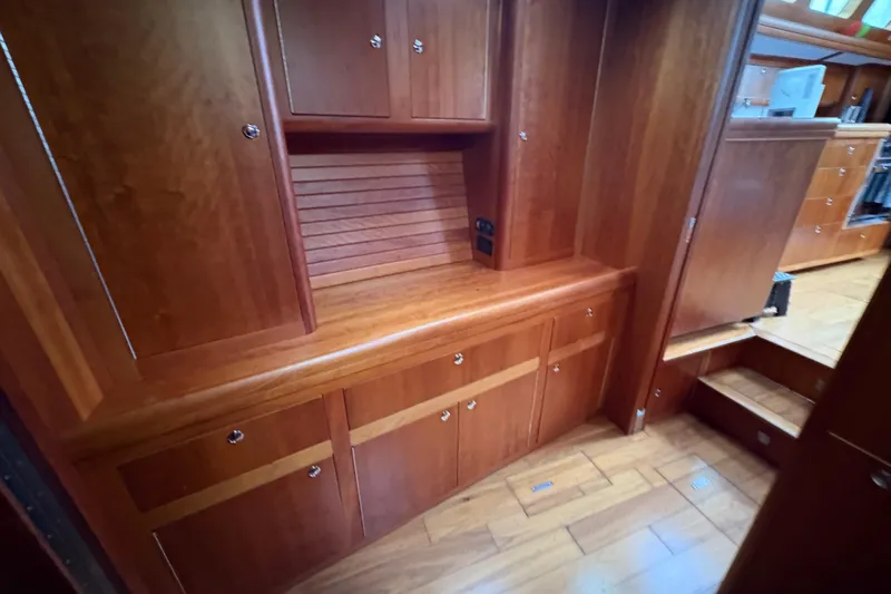 Lino Yacht Photos Pics Luxurious wooden interior of 2019 Chatam Extreme 42 yacht, featuring elegant cabinetry and flooring.