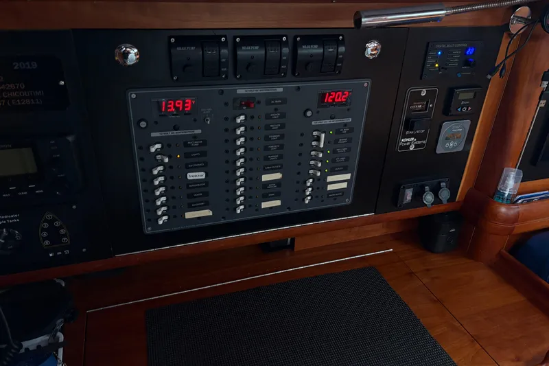 Lino Yacht Photos Pics Control panel of a 2019 Chatam Extreme 42 yacht, featuring various switches and digital displays.