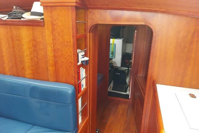 Lino Yacht Photos Pics Interior of 2019 Custom Chatam Extreme 42 yacht with wooden finish and blue seating.