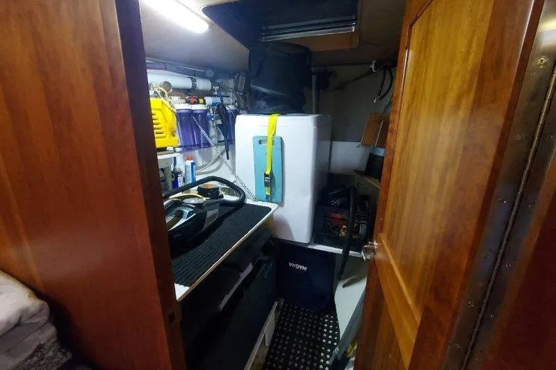 Lino Yacht Photos Pics Utility room inside 2019 Custom Chatam Extreme 42 yacht, featuring storage and equipment.