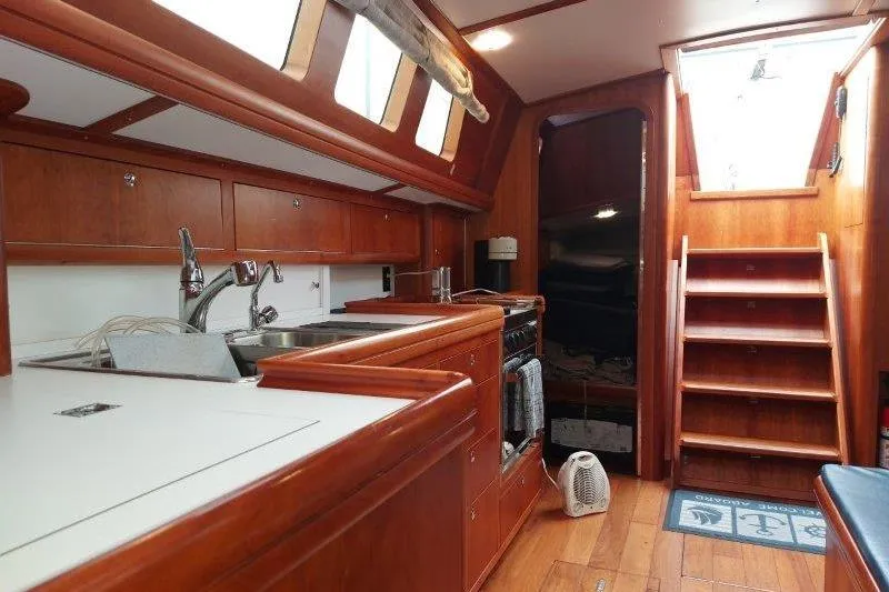 Lino Yacht Photos Pics Interior of 2019 Custom Chatam Extreme 42 yacht with wooden cabinetry and stairs.