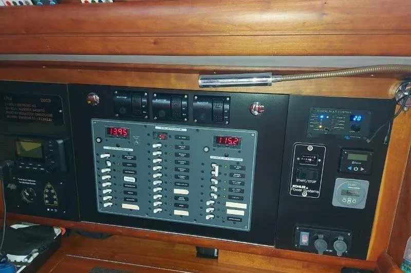 Lino Yacht Photos Pics Electrical control panel on 2019 Custom Chatam Extreme 42 yacht, featuring switches and digital displays.