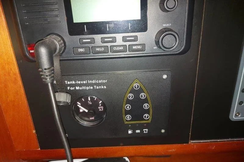 Lino Yacht Photos Pics Control panel of 2019 Custom Chatam Extreme 42 with tank-level indicator and keypad.