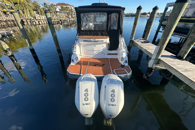  Yacht Photos Pics 2025 NX Boats 370 with twin Mercury 400 engines docked at a marina.