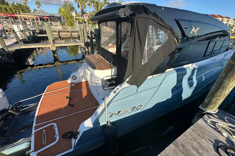  Yacht Photos Pics 2025 NX Boats 370 docked, featuring sleek design and modern amenities.
