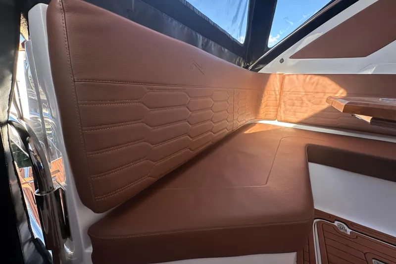  Yacht Photos Pics Luxurious brown leather seating on 2025 NX Boats 370, featuring elegant stitching and modern design.