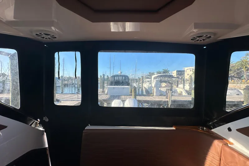  Yacht Photos Pics Interior view from NX Boats 370, 2025 model, overlooking marina with docked boats.