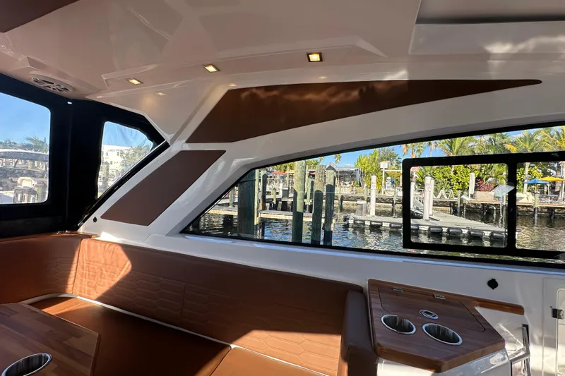  Yacht Photos Pics Interior of 2025 NX Boats 370, featuring sleek design and waterfront view.