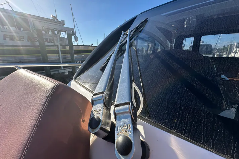  Yacht Photos Pics 2025 NX Boats 370 windshield wipers and leather seat detail at marina.