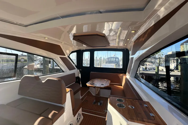  Yacht Photos Pics Interior of 2025 NX Boats 370, featuring sleek design and comfortable seating.