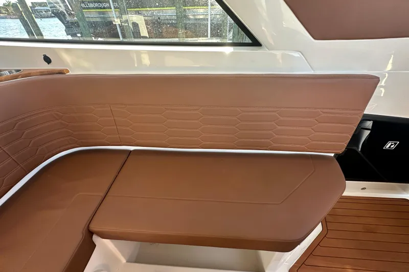  Yacht Photos Pics Luxurious brown seating on 2025 NX Boats 370, featuring elegant stitching and modern design.
