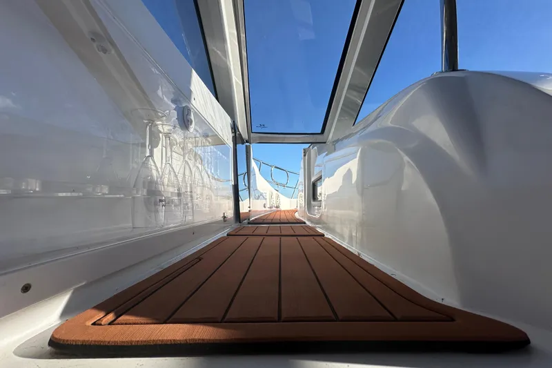  Yacht Photos Pics Interior view of 2025 NX Boats 370, featuring sleek design and wooden flooring.