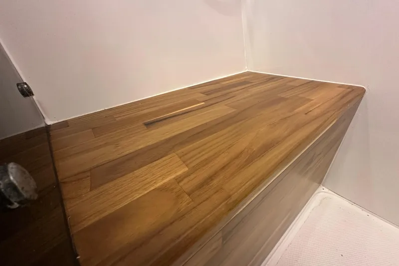  Yacht Photos Pics Wooden interior detail of 2025 NX Boats 370, showcasing sleek design and craftsmanship.