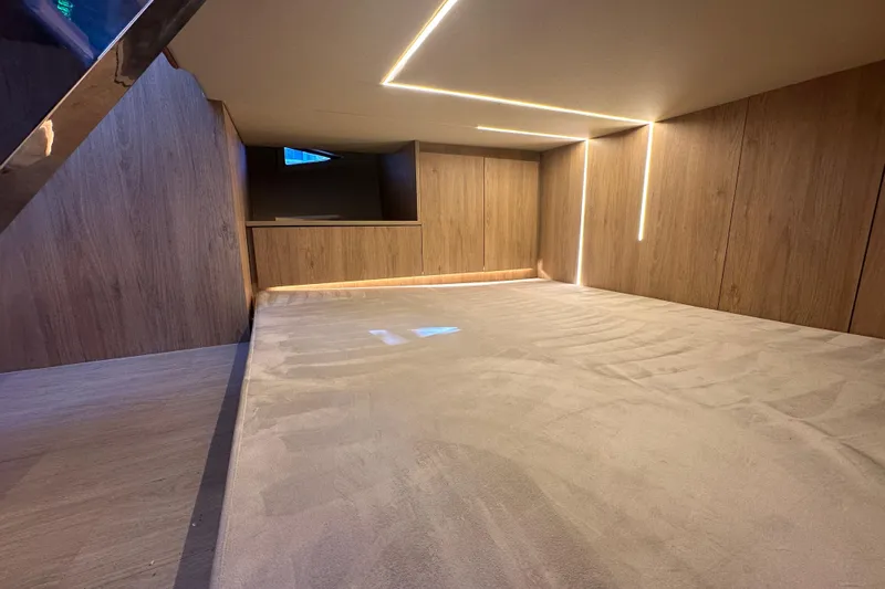  Yacht Photos Pics Luxurious interior cabin of 2025 NX Boats 370 with modern wood paneling and ambient lighting.