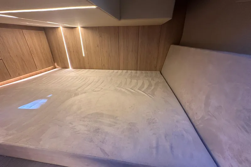  Yacht Photos Pics Luxurious interior cabin of 2025 NX Boats 370 with modern lighting and plush bedding.