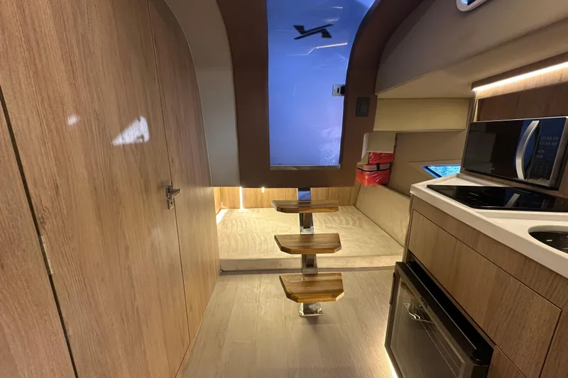  Yacht Photos Pics Interior of 2025 NX Boats 370, featuring modern kitchen and wooden accents.