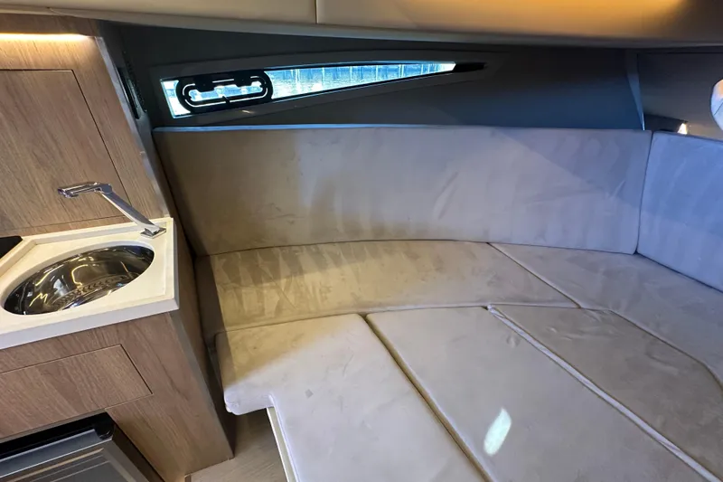  Yacht Photos Pics Luxurious interior of 2025 NX Boats 370 with cozy seating and modern sink.