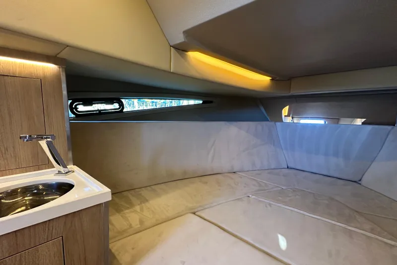  Yacht Photos Pics Luxurious interior cabin of 2025 NX Boats 370 with modern sink and ambient lighting.