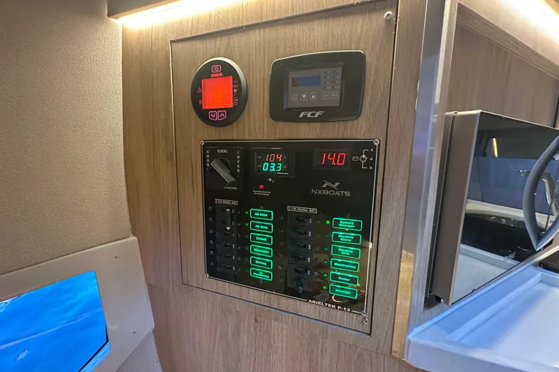  Yacht Photos Pics Control panel of 2025 NX Boats 370, featuring digital displays and switches.
