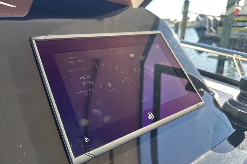  Yacht Photos Pics Display screen on 2025 NX Boats 370 showing engine hours and maintenance data.