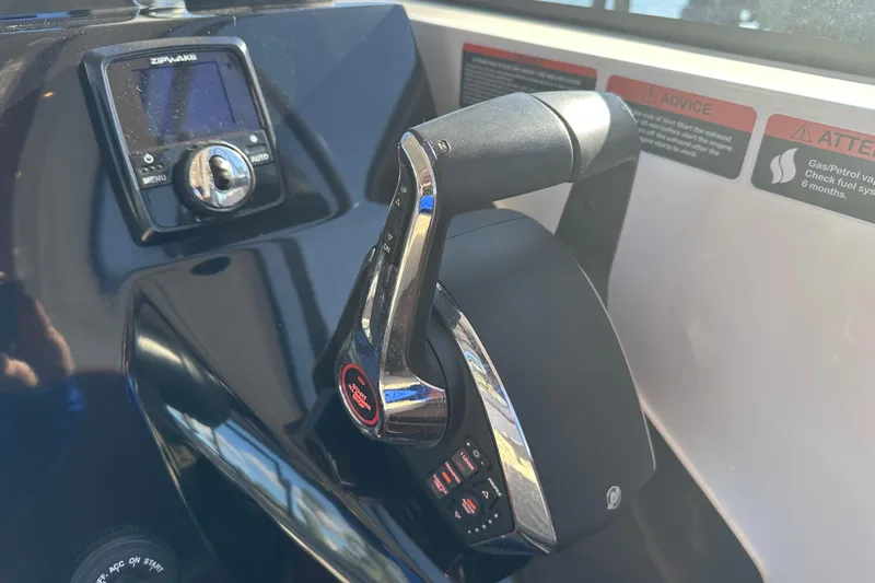  Yacht Photos Pics Throttle control and display panel of 2025 NX Boats 370, featuring modern navigation technology.