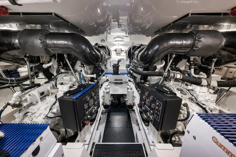 Bottom Line Yacht Photos Pics Engine room of 2012 Viking 60 Enclosed Bridge yacht, featuring advanced machinery and controls.