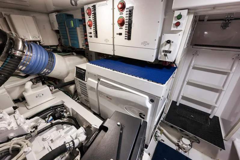 Bottom Line Yacht Photos Pics Engine room of 2012 Viking 60 Enclosed Bridge yacht with Cummins Onan generator.