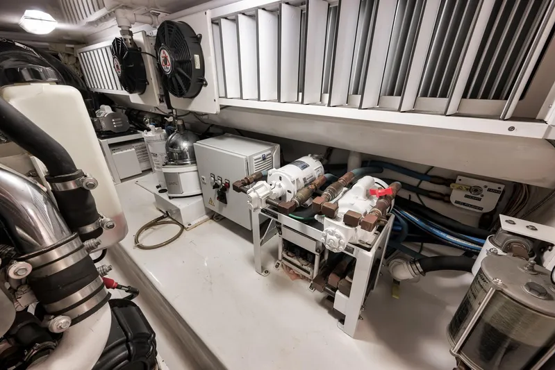 Bottom Line Yacht Photos Pics Engine room of 2012 Viking 60 Enclosed Bridge yacht, showcasing mechanical components and systems.