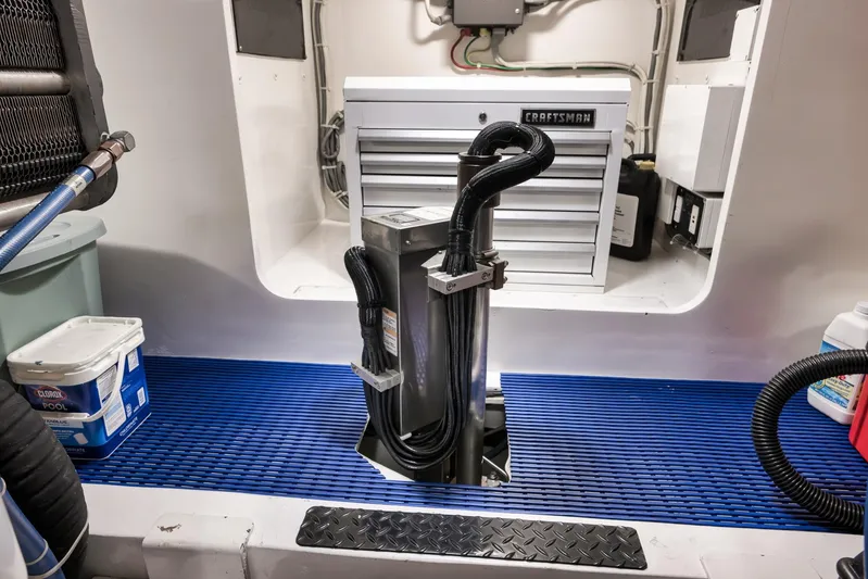 Bottom Line Yacht Photos Pics Engine room of 2012 Viking 60 Enclosed Bridge with tools and equipment.