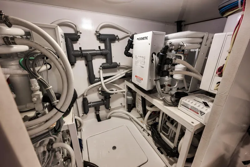 Bottom Line Yacht Photos Pics Engine room of 2012 Viking 60 Enclosed Bridge yacht with Dometic systems and piping.