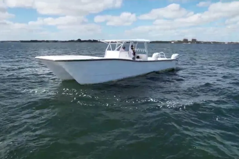 N/a Yacht Photos Pics 2025 AmeraCat 39 boat cruising on open water under a partly cloudy sky.