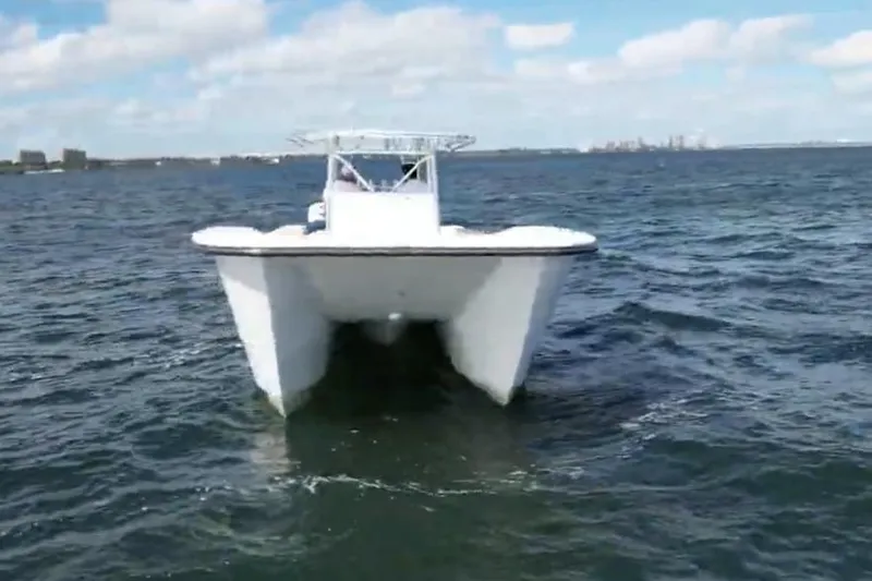 N/a Yacht Photos Pics 2025 AmeraCat 39 catamaran cruising on open water under a clear sky.