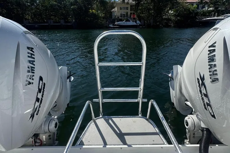 N/a Yacht Photos Pics 2025 AmeraCat 39 boat with Yamaha engines, docked by a serene waterfront.