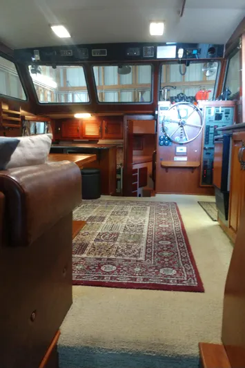 Elizabeth Rose Yacht Photos Pics Interior of a 1981 Tollycraft 43 Motoryacht with wood paneling and nautical decor.