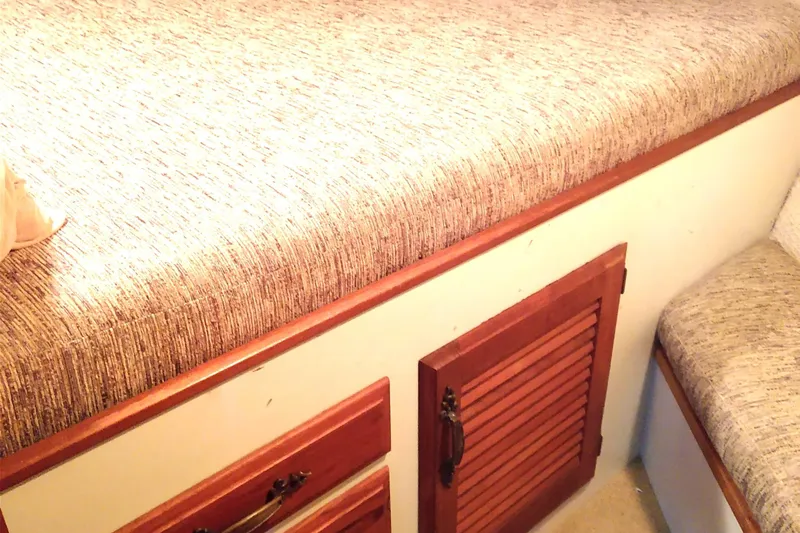 Elizabeth Rose Yacht Photos Pics 1981 Tollycraft 43 Motoryacht interior with wooden cabinets and upholstered seating.