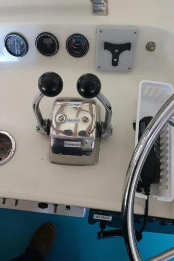 Elizabeth Rose Yacht Photos Pics Control panel of a 1981 Tollycraft 43 Motoryacht with throttle levers and gauges.