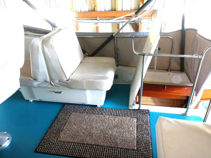 Elizabeth Rose Yacht Photos Pics 1981 Tollycraft 43 Motoryacht interior with seating and carpeted floor.