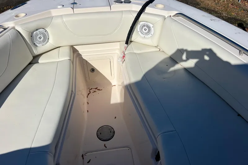  Yacht Photos Pics Interior of 2011 Grady-White Freedom 307 boat with white seating and speakers.