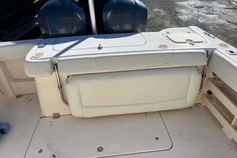  Yacht Photos Pics 2011 Grady-White Freedom 307 boat interior with seating and dual engines.