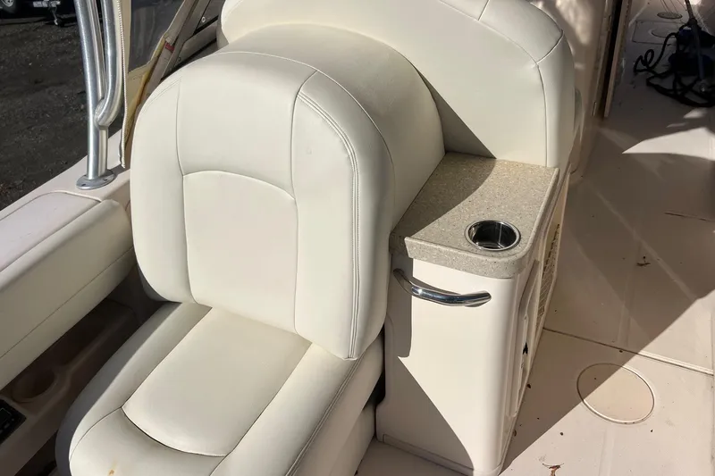  Yacht Photos Pics 2011 Grady-White Freedom 307 boat interior with white seating and cup holder.