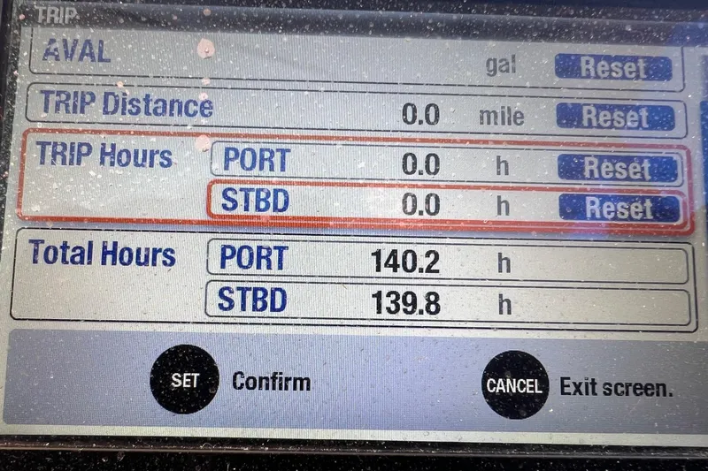  Yacht Photos Pics Boat dashboard display showing trip and total hours for Grady-White Freedom 307, 2011 model.