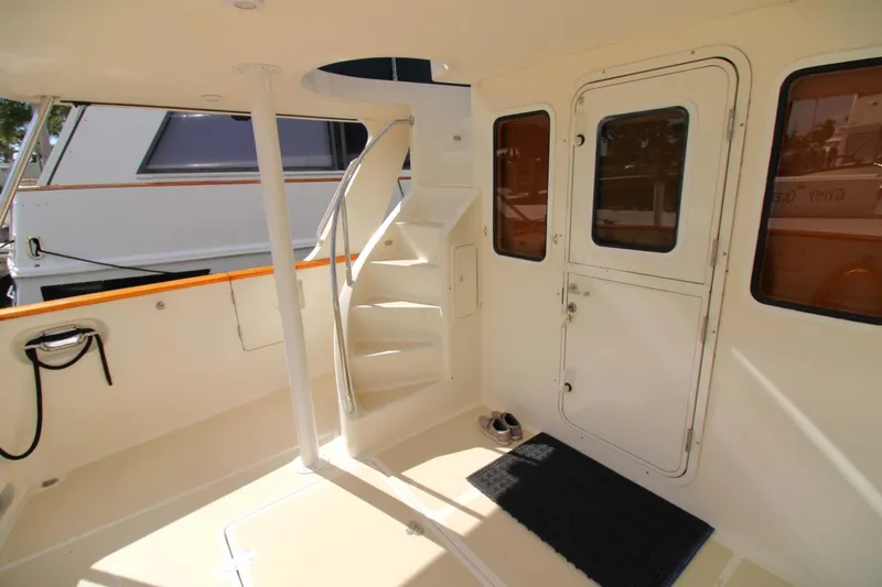 The Concession Yacht Photos Pics Selene 53 Pilothouse 2001 yacht deck with spiral staircase and door.