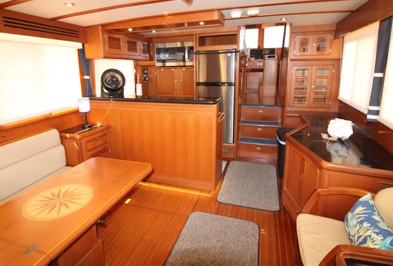 The Concession Yacht Photos Pics Luxurious interior of 2001 Selene 53 Pilothouse yacht with wood finishes and modern amenities.