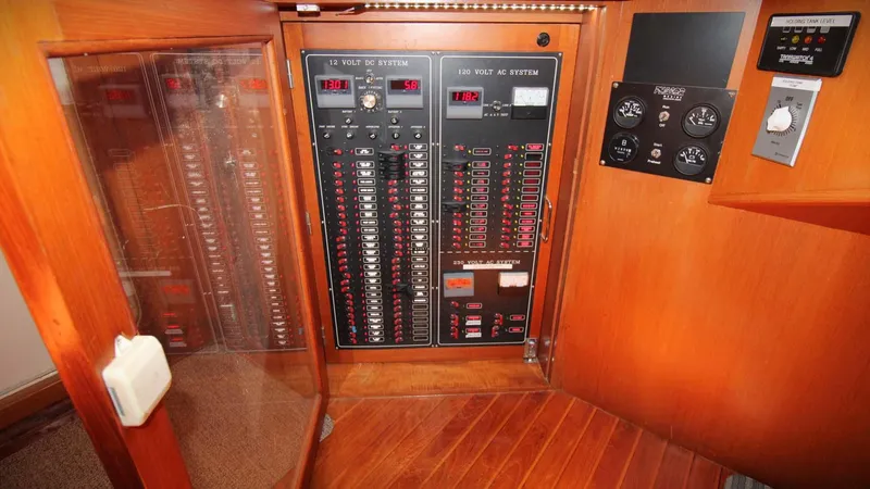 The Concession Yacht Photos Pics Electrical panel inside a 2001 Selene 53 Pilothouse yacht, featuring circuit breakers and controls.
