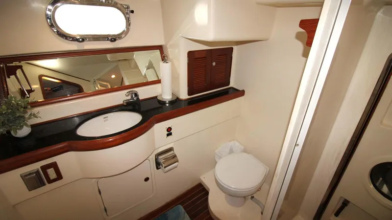 The Concession Yacht Photos Pics Bathroom interior of 2001 Selene 53 Pilothouse yacht with sink, toilet, and mirror.