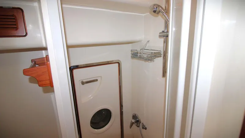 The Concession Yacht Photos Pics Compact bathroom in 2001 Selene 53 Pilothouse yacht with shower and storage.