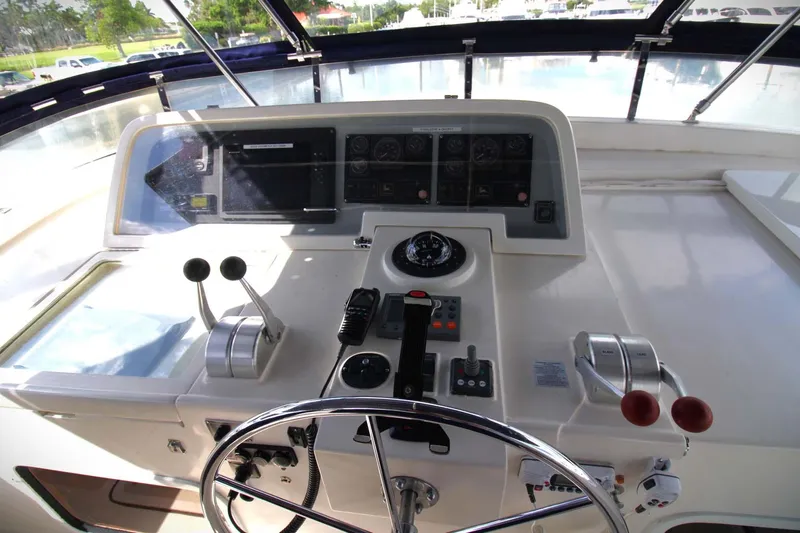 The Concession Yacht Photos Pics 2001 Selene 53 Pilothouse helm with steering wheel, controls, and navigation instruments.